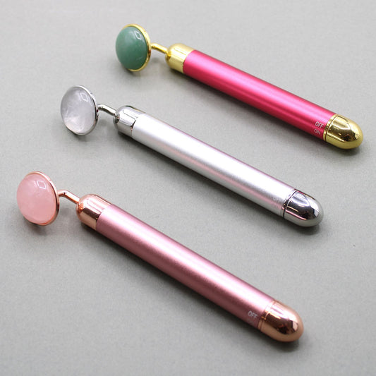 Gemstone Vibration Pad - Rock Quartz - A sleek handheld massage tool featuring a smooth Rock Quartz stone head and gentle