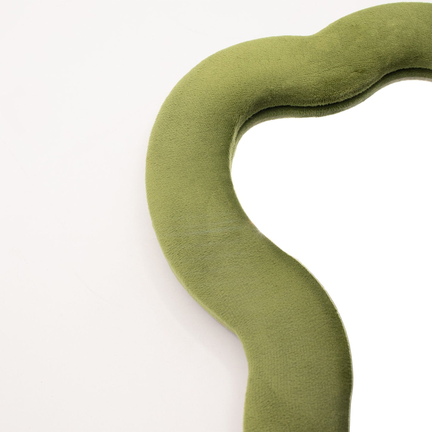 Green velvet mirror on a white background
