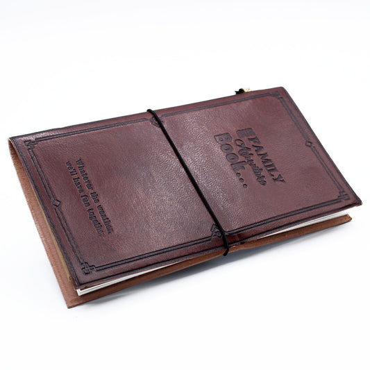 Brown leather-bound book with embossed text on a white background