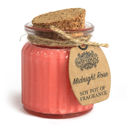 Candle in a glass jar with a cork lid and 'Bamboo' label on a white background